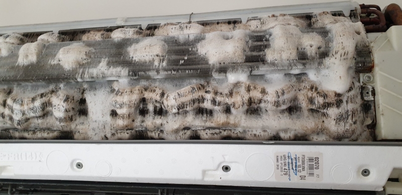 Foaming spray on an indoor AC coil - prepped for a Pressure Clean.